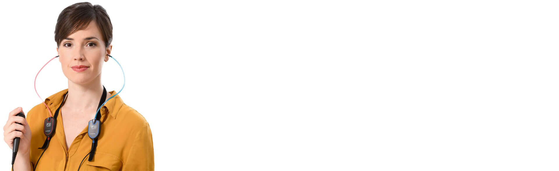 Lady about to push a patient hand switch wearing IP30 earphones